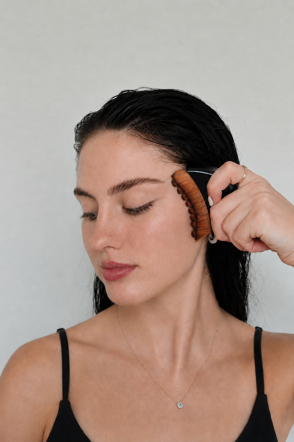 Using the Lymphatic Drainage Brush along the face